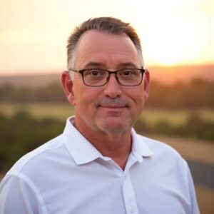 Portrait of Ralph Harvey on a landscape background