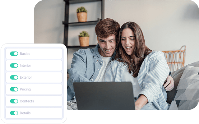 Couple looking at the laptop excited and smiling.