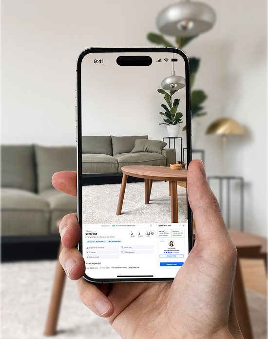 Smartphone capturing a photo of a home interior.