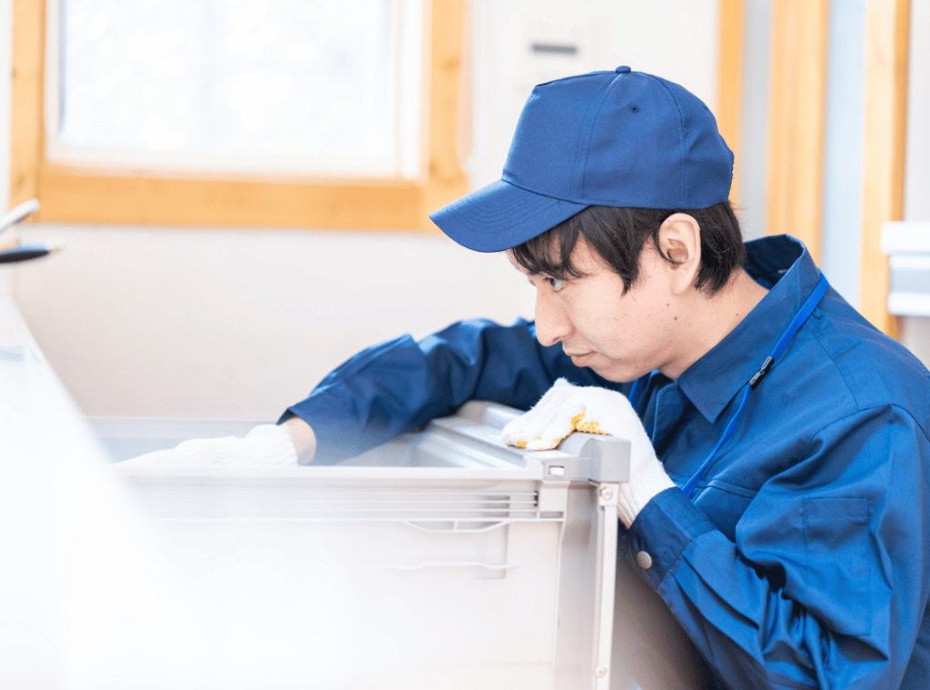 man looking at house conditions during inspection