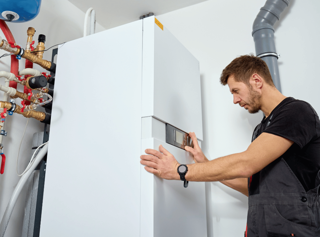 man checking water connections during home inspection
