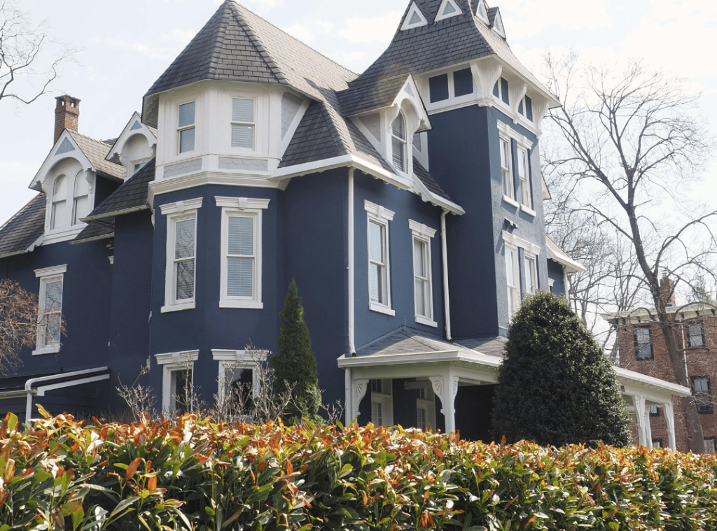 pennsylvania victorian house with plants in front yard