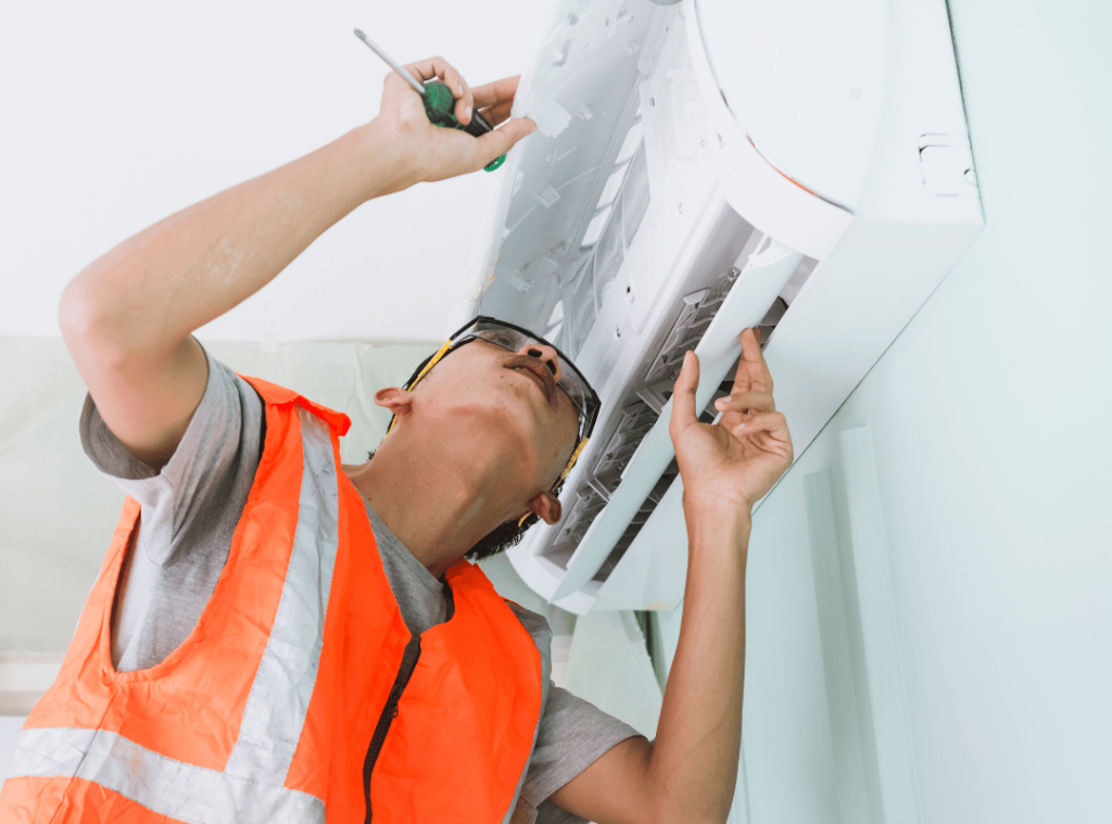 man looking at ac conditioner during home inspection