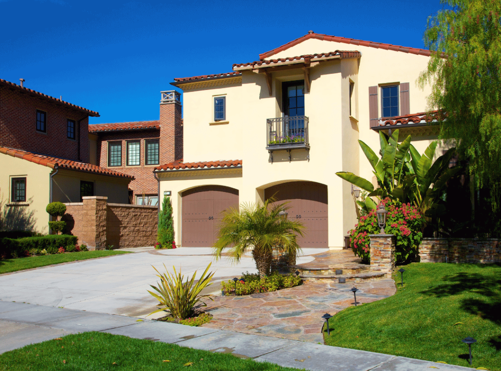 california home with beige walls and green front lawn