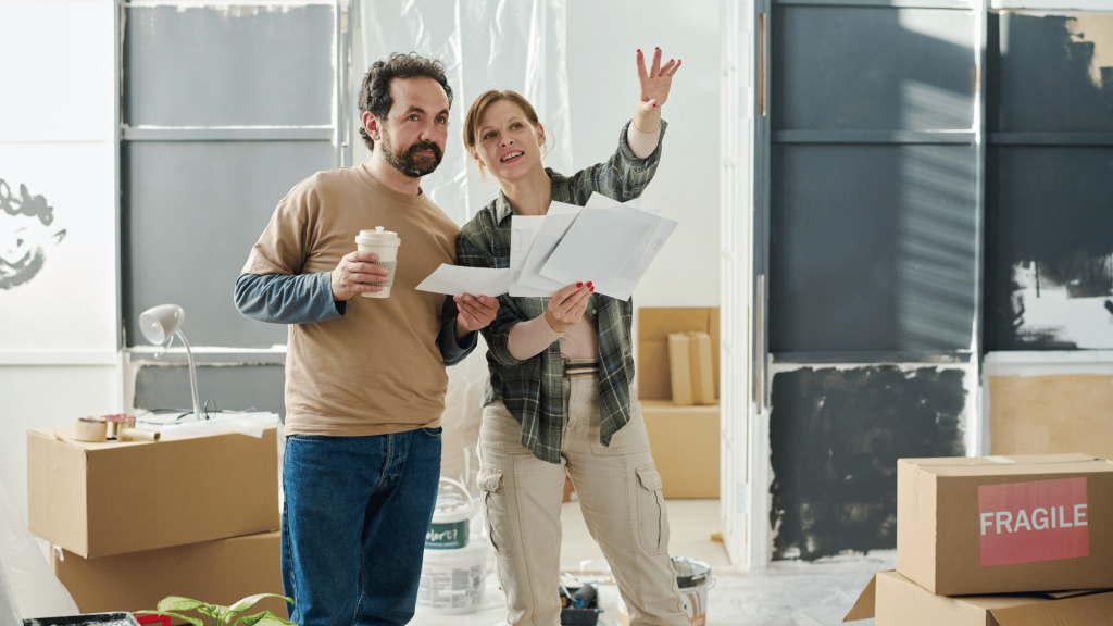 man and woman discussing home renovations before selling their home